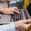 person typing laptop close up