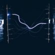 A closeup shot of electrical chipsets transmitting energy through each other on a dark background