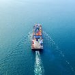 Aerial view of container cargo ship in sea.