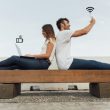 couple bench using social media
