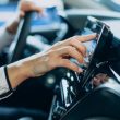 woman touching screen her car
