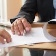 Business people signing a contract
