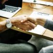 Business people shaking hands in agreement