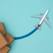An airplane posing with boxes on a blue background