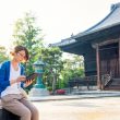 A woman in Japan reading on her tablet