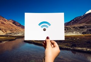 A picture of a wi-fi logo on a mountain background