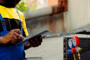 A worker doing a leak test