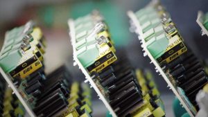 Close-up of printed circuit boards with surface-mounted components, representing a compact certified wireless module for industrial IoT devices